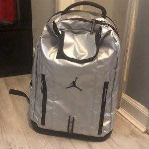 Metallic Silver Jordan Backpack. Six Pockets.